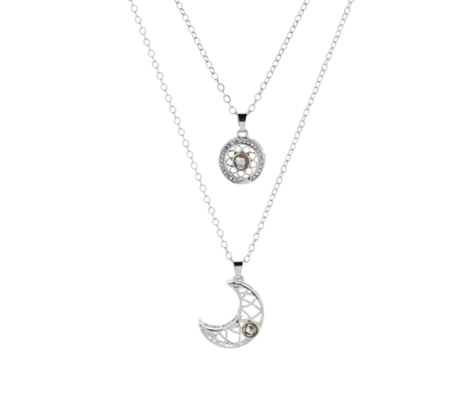 Set de collar plateado con dijes de luna y círculo con incrustaciones
