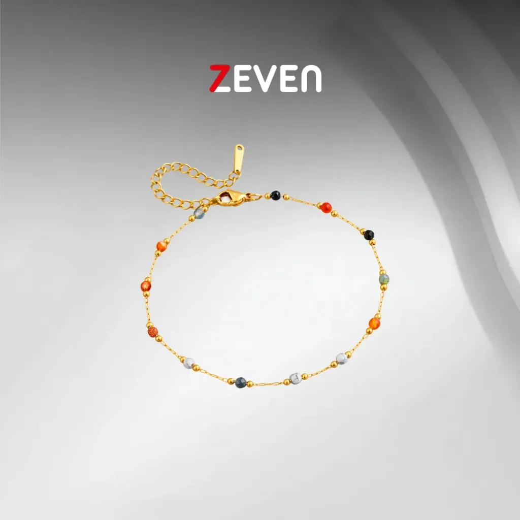 Tobillera de acero dorado con perlas de colores