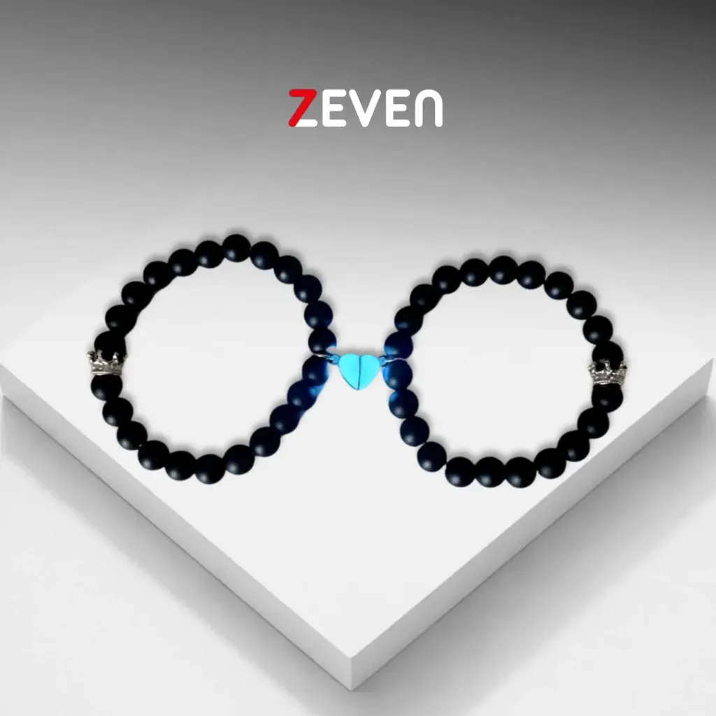 Set de pulsera magnéticas de piedras negras con dije de cerazón fosforecente